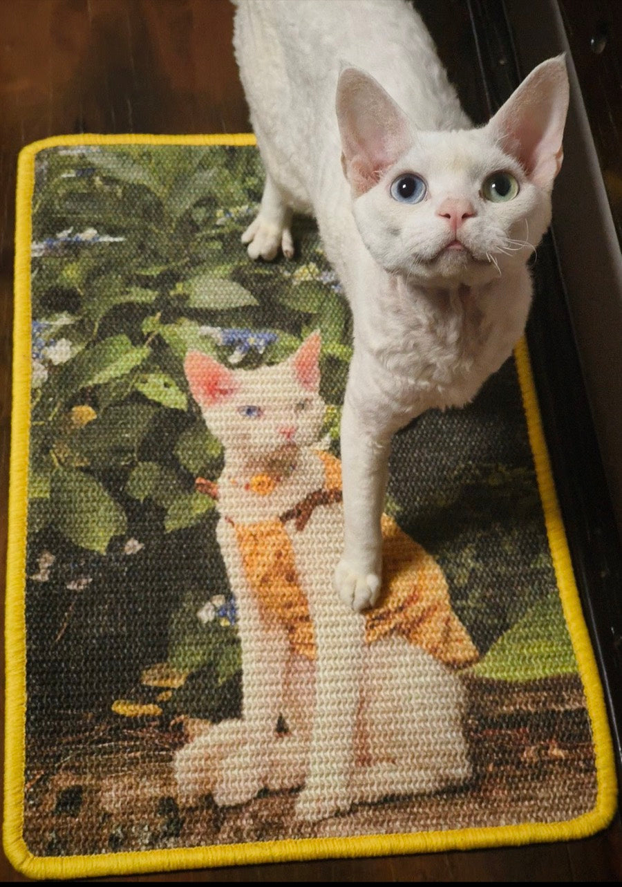 Customer's white cat standing on its yellow-edged custom portrait scratcher